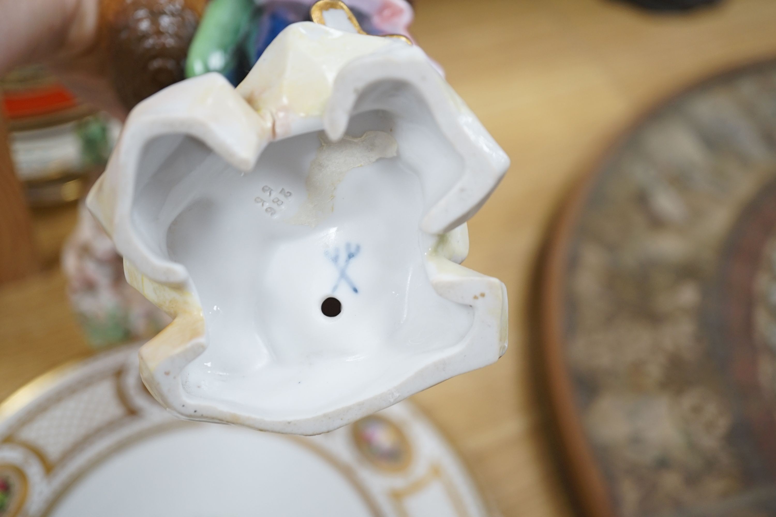 A collection of 19th century English porcelain plates and mugs and a Derby Cupid group, c.1775
